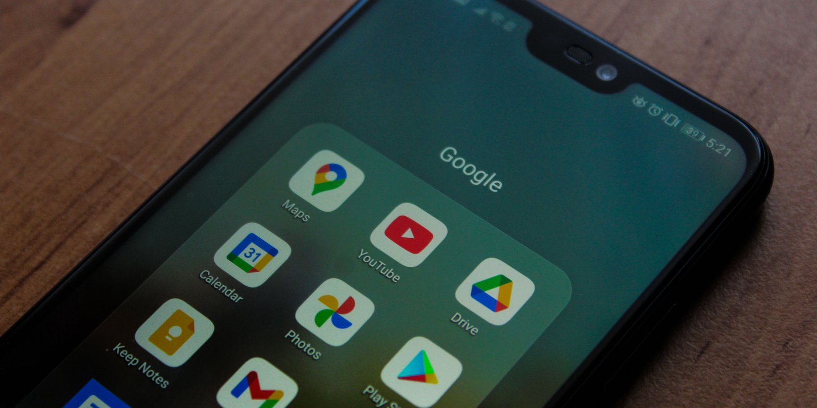 phone-screen-on-desk-open-to-google-folder
